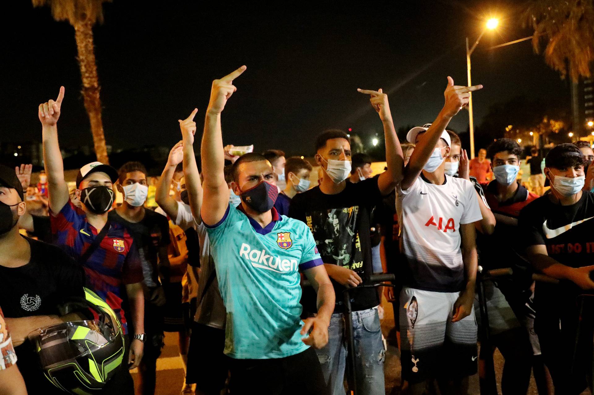 Barcelona fans are seen outside the Camp Nou after captain Lionel Messi told Barcelona he wishes to leave the club immediately