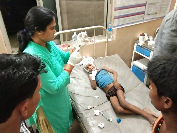 A victim of a thunderstorm undergoes treatment at a hospital in Parsha District