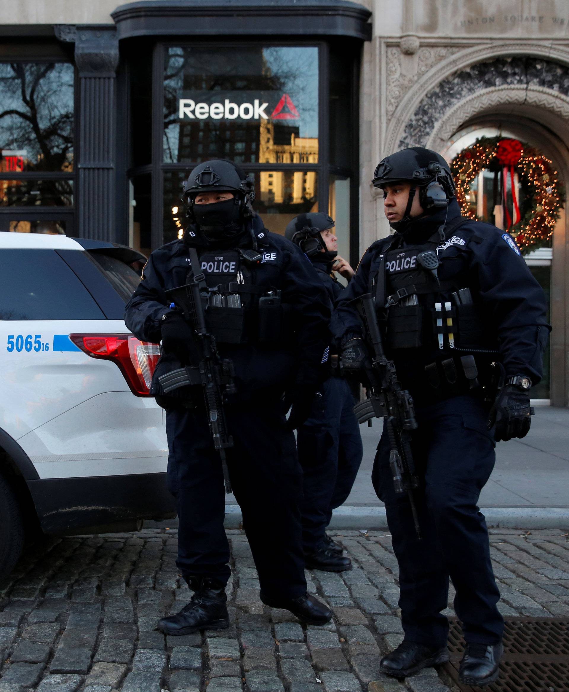 Members of the New York Police Department's Counterterrorism Bureau arrive to stand watch at the Union Square Holiday market following the Berlin Christmas market attacks in Manhattan, New York City, U.S.