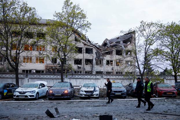 Rescuers work at the site of a Russian missile strike, amid Russia's attack on Ukraine, in Kyiv