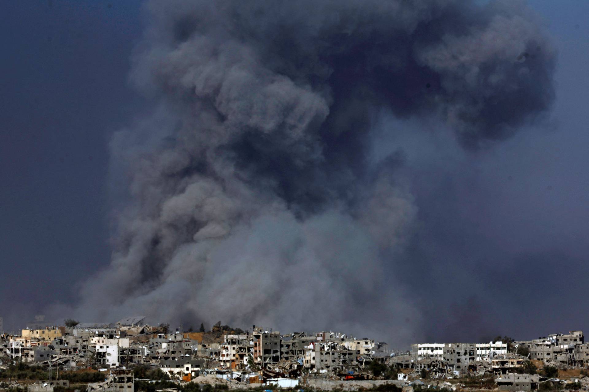 Smoke and debris rises over Gaza as seen from southern Israel