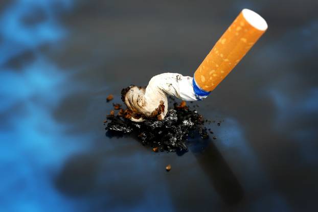 Cigarette on x-ray lung, close up