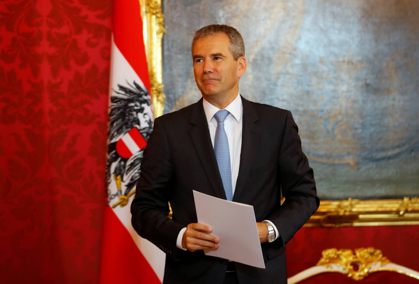 Hartwig Loeger reacts after being sworn in as Austria's provisional chancellor by Austrian President Alexander Van der Bellen, after a no-confidence vote by the Parliament in Vienna