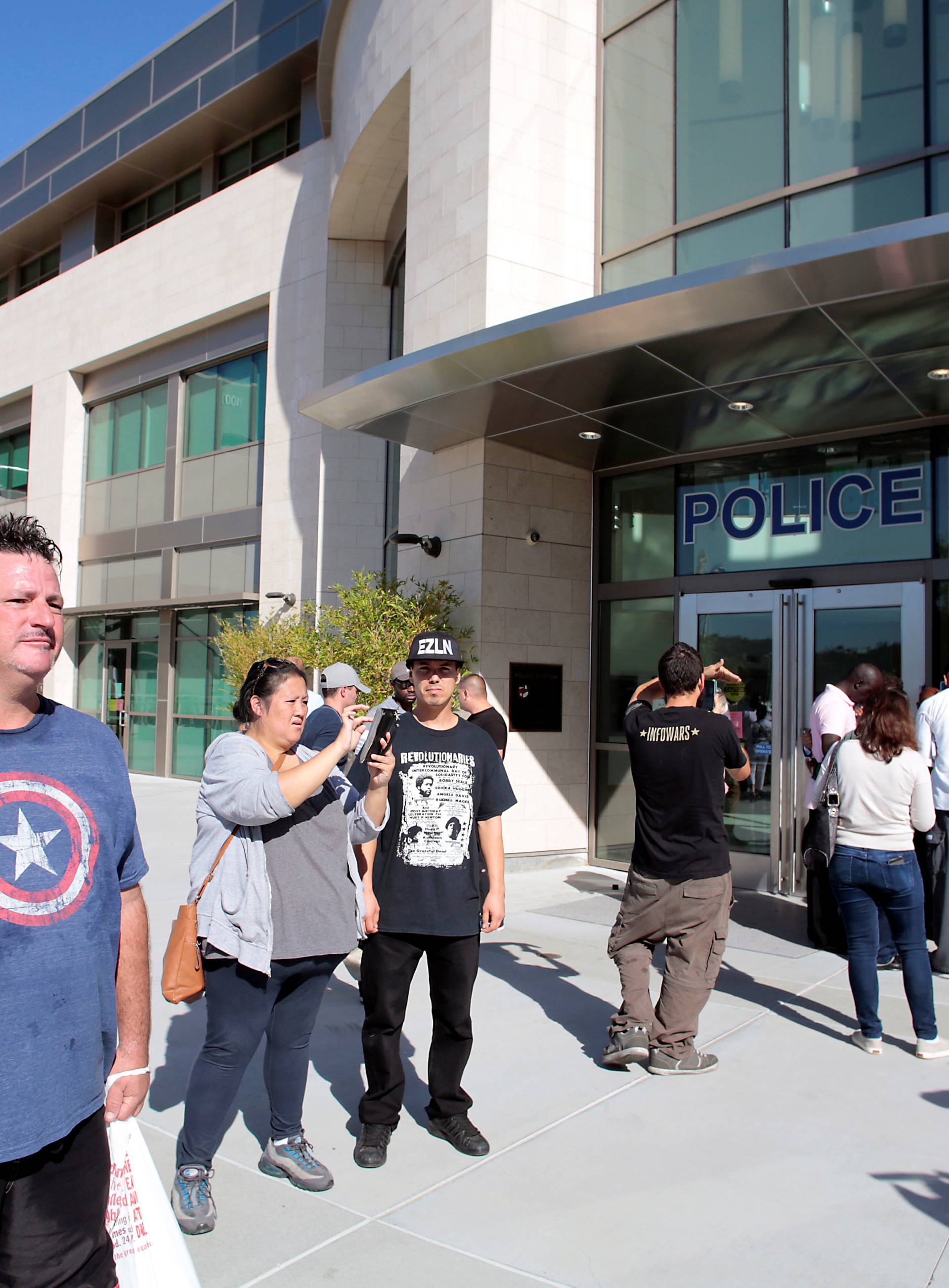 Protesters gather at the El Cajon Police Department headquarters to protest fatal shooting of an unarmed black man Tuesday by officers in El Cajon, California