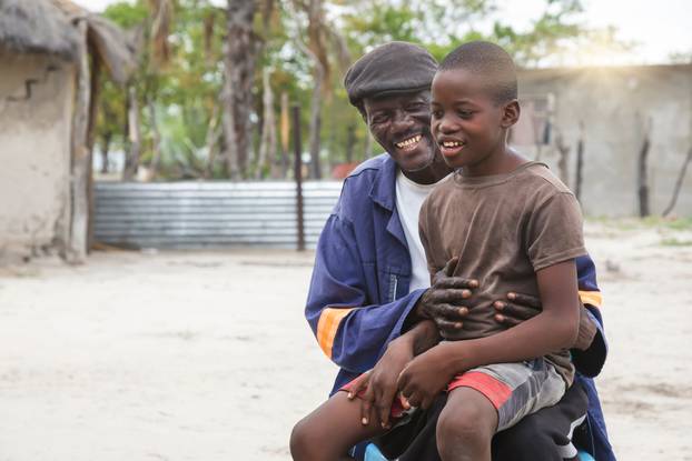 Old,African,Village,Man,In,Front,Of,His,House,Together