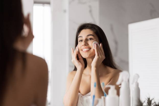 Beautiful Young Woman in Bathroom