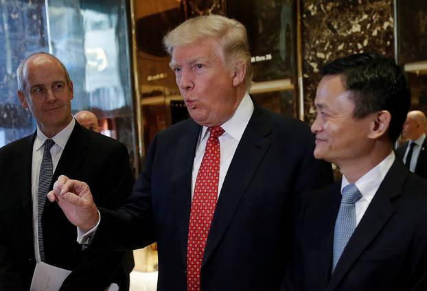 U.S. President-elect Donald Trump and Alibaba Executive Chairman Jack Ma speak with members of the news media after their meeting at Trump Tower in New York, U.S.