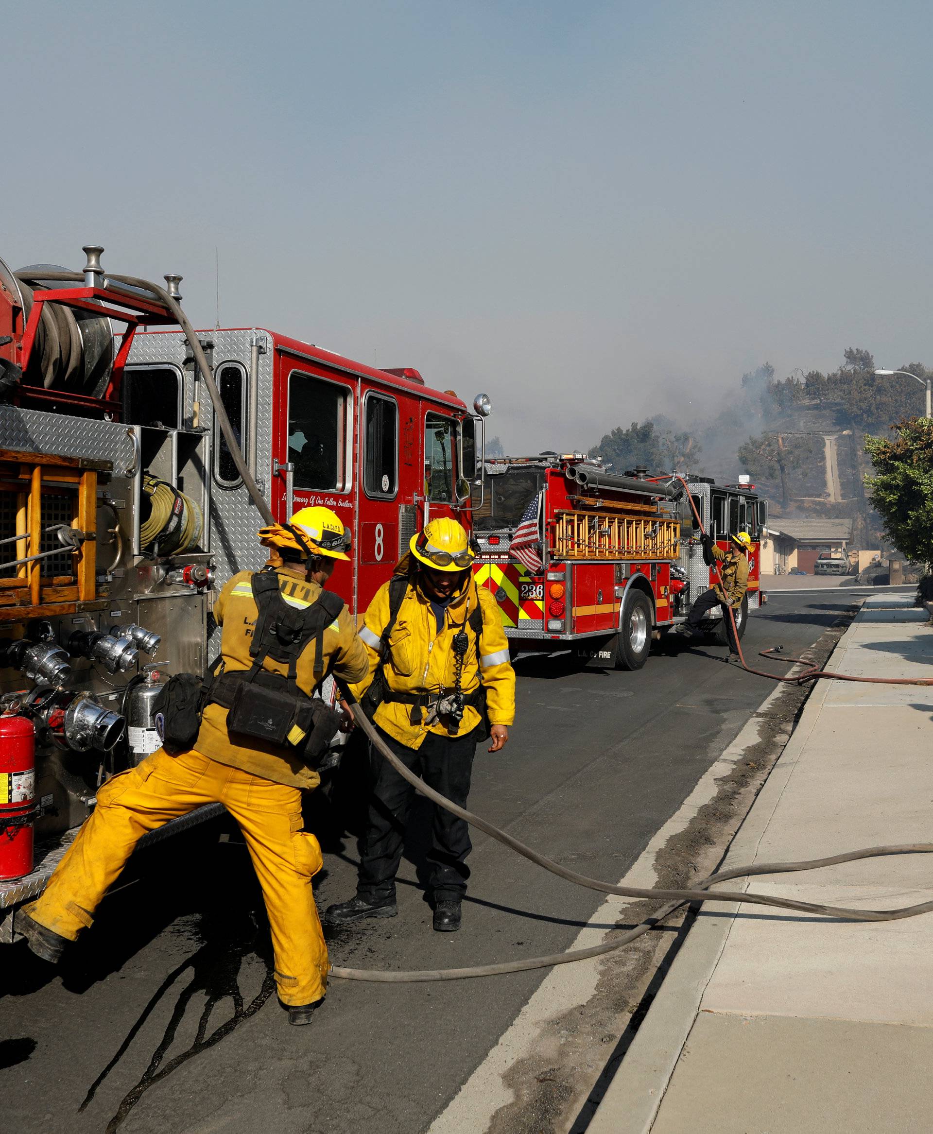Firefighters from LA County assist during wildfire in Ventura, California