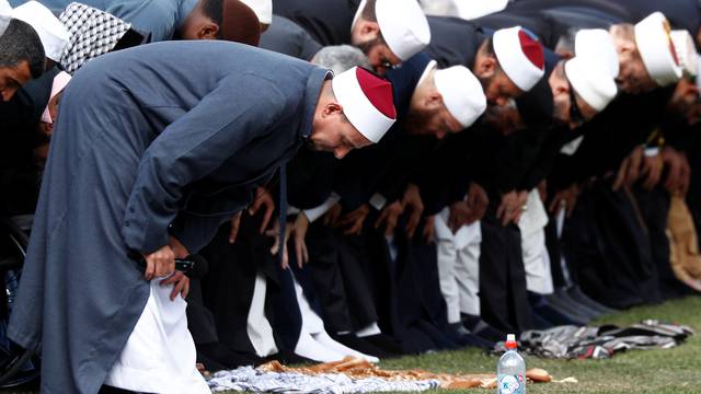 Imam Gamal Fouda leads a Friday prayer at Hagley Park outside Al-Noor mosque in Christchurch, New Zealand