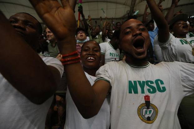 Members of the NYSC react during the World Cup qualifier match between Nigeria and Ghana at the Moshood Abiola Stadium in Abuja