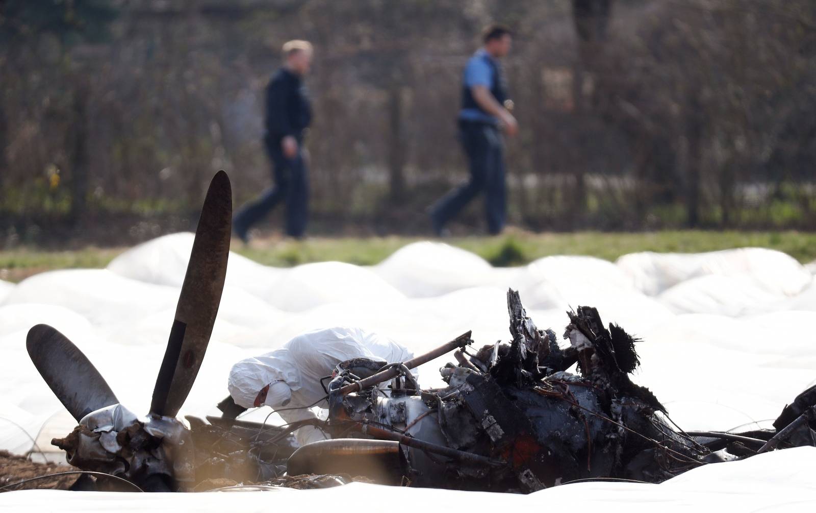 An expert inspects the wreckage of an Epic1000 plane in which Natalia Fileva, co-owner and chairwoman of Russia's second largest airline S7 was killed after the plane crashed near Frankfurt