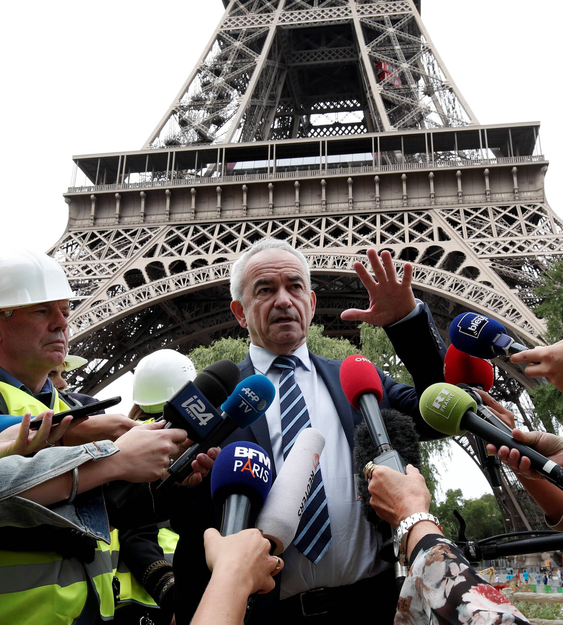 Bernard Gaudillere, President of the The Societe d'Exploitation de la Tour Eiffel (SETE) spekas to members of the media in front of the Eiffel Tower in Paris