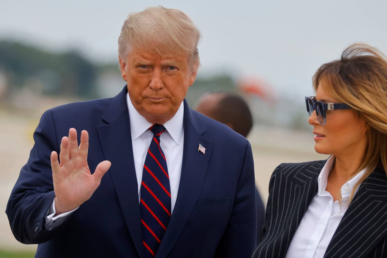U.S. President Donald Trump walks with first lady Melania Trump at Cleveland Hopkins International Airport in Cleveland, Ohio