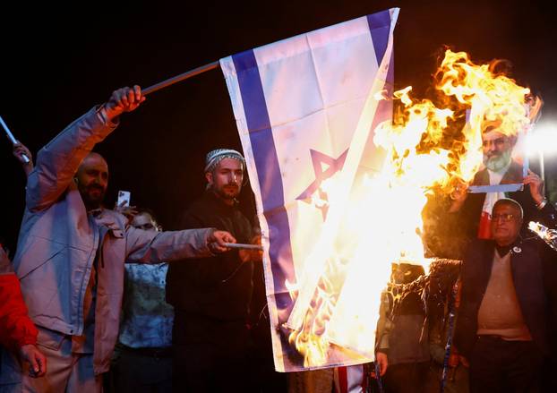People gather after a two-week ceasefire in the Iran war was announced, in Tehran