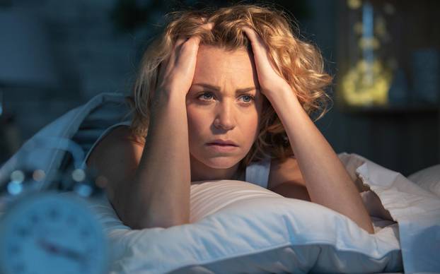 depressed woman awake in the night