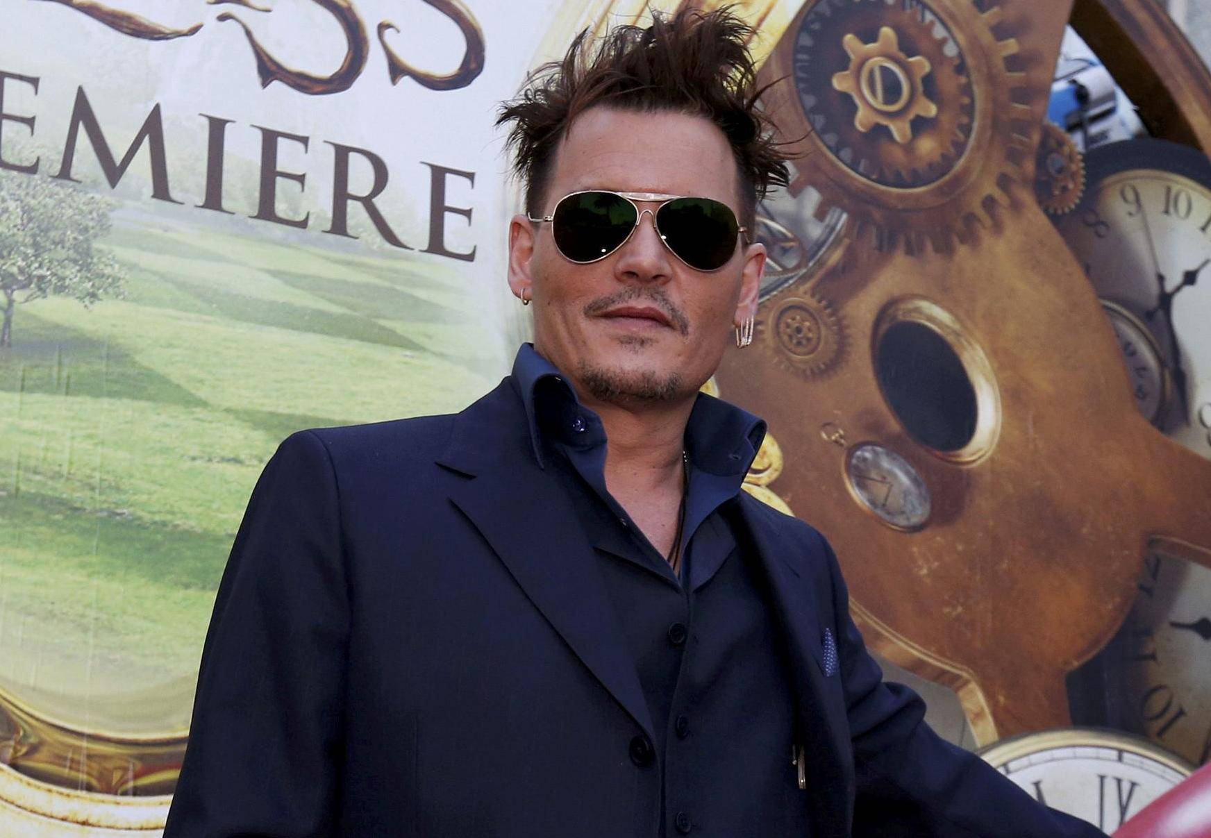 FILE PHOTO -  Cast member Depp poses at the premiere of "Alice Through the Looking Glass" at El Capitan theatre in Hollywood