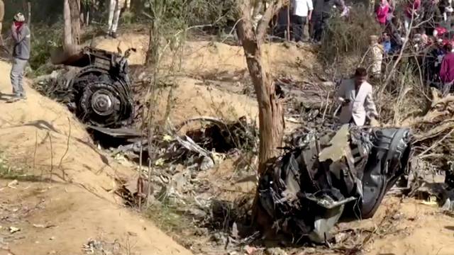 A general view of the debris of a crashed aircraft in Bharatpur