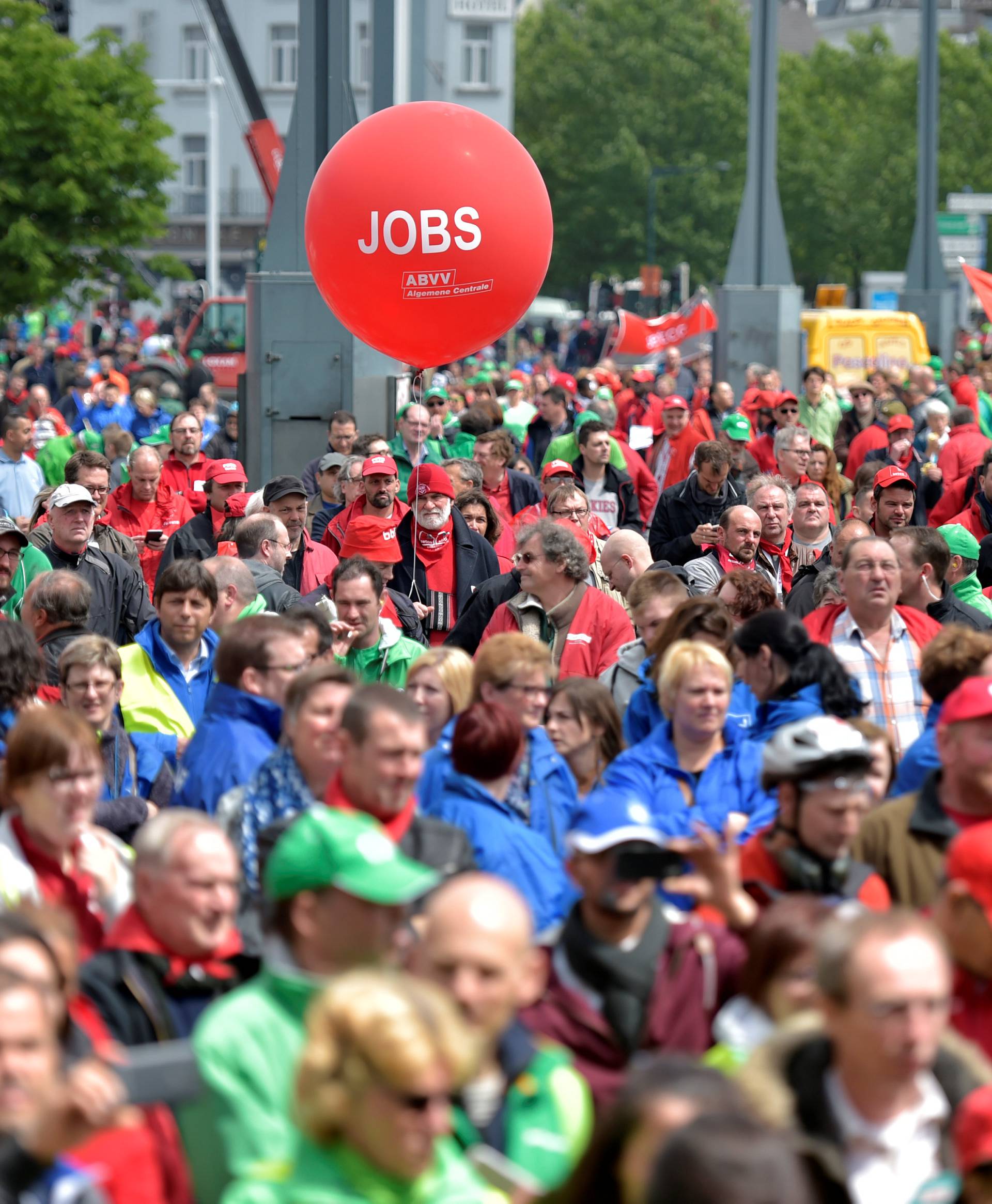 Demonstrators, protesting government reforms and cost-cutting measures, march in central Brussels