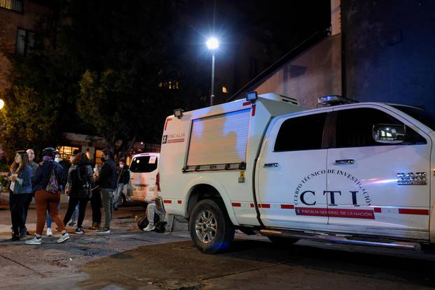 Police vans are seen outside the Casa Medina hotel, where Taylor Hawkins, drummer of the band Foo Fighters was staying, who died hours before his presentation at the Estereo Picnic festival, in Bogota