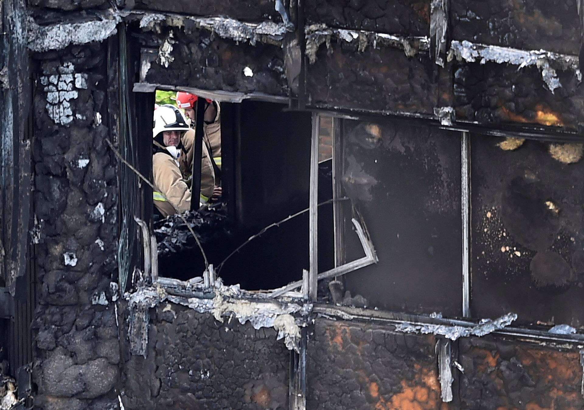 Firefighters at the Grenfell Tower block which was destroyed in a disastrous fire, in north Kensington, West London