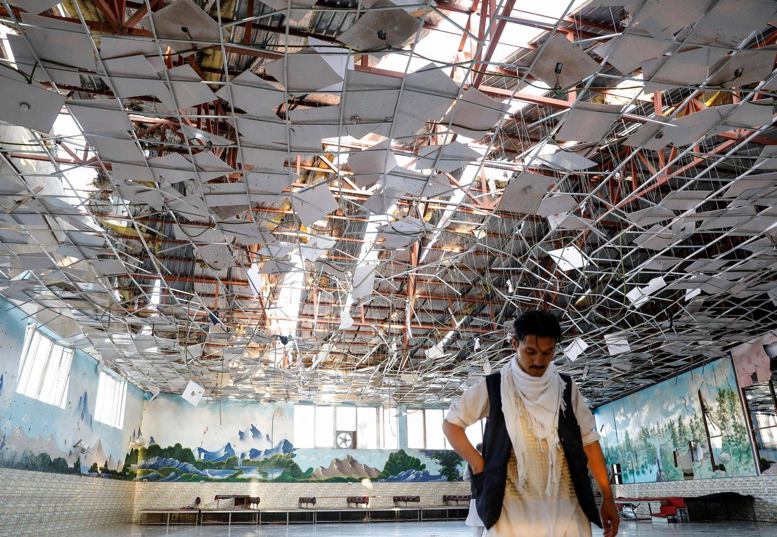 A damaged wedding hall is seen after a blast in Kabul, Afghanistan