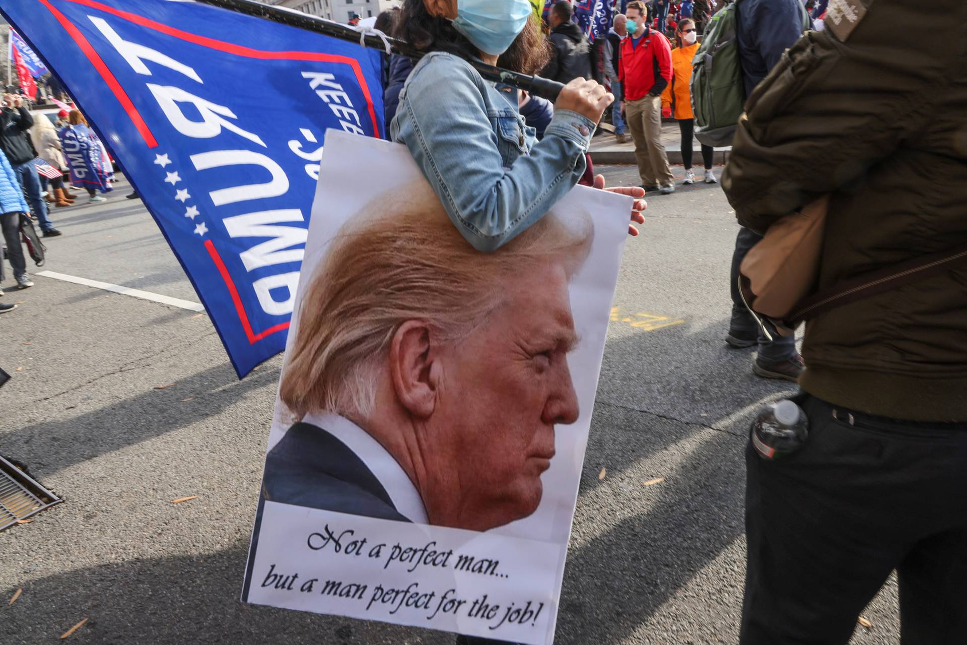 People take part in a rally to protest the results of the election, in Washington
