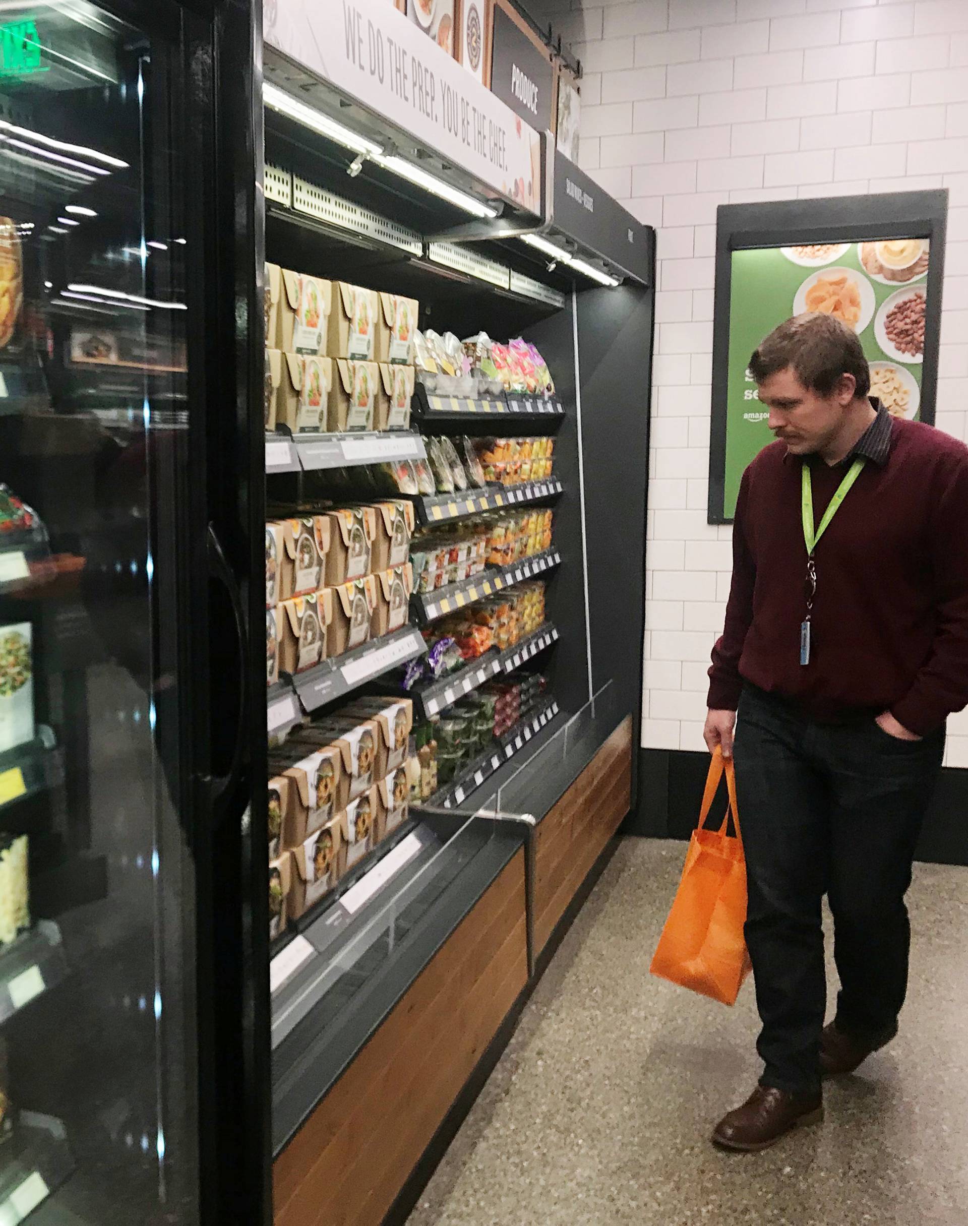 Customer browses meal-kit options at Amazon's new "grab-and-go" store in Seattle
