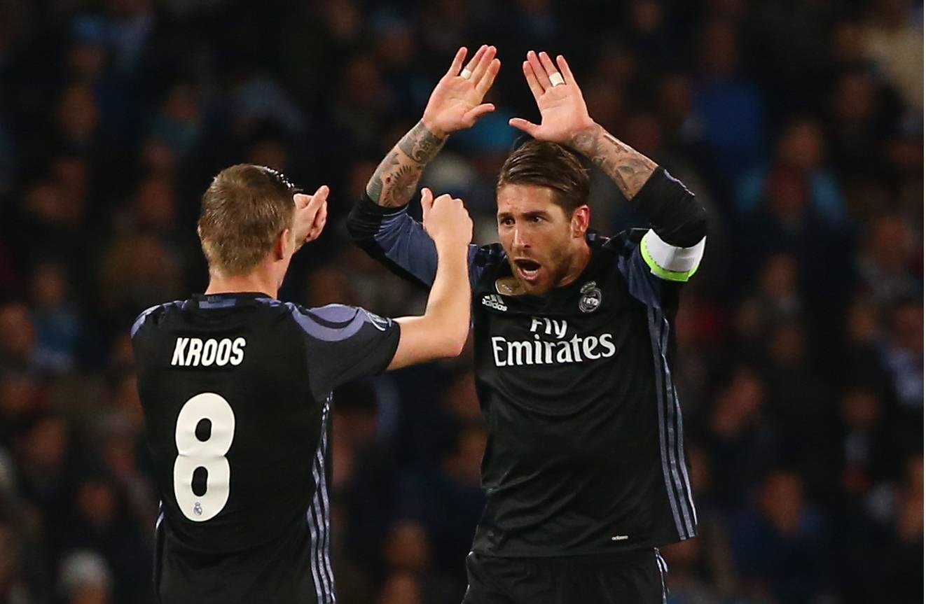 Real Madrid's Sergio Ramos celebrates scoring their first goal with Toni Kroos