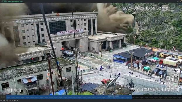 A CCTV footage shows people running away as wall of mud and water destroys buildings in a valley at Nepal-China border, in Gyirong