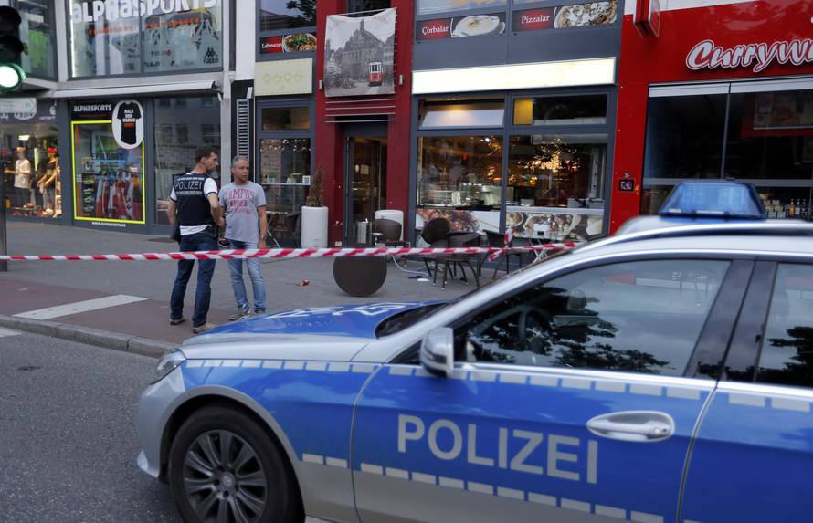 Police patrol outside where a 21-year-old Syrian refugee killed a woman with a machete in Reutlingen