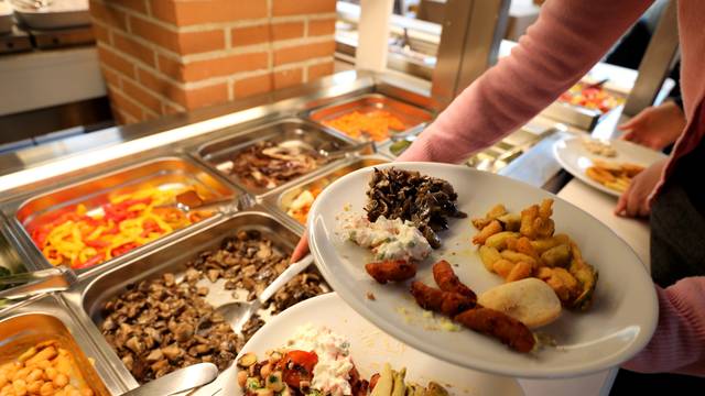 self service restaurant with many raw and cooked foods