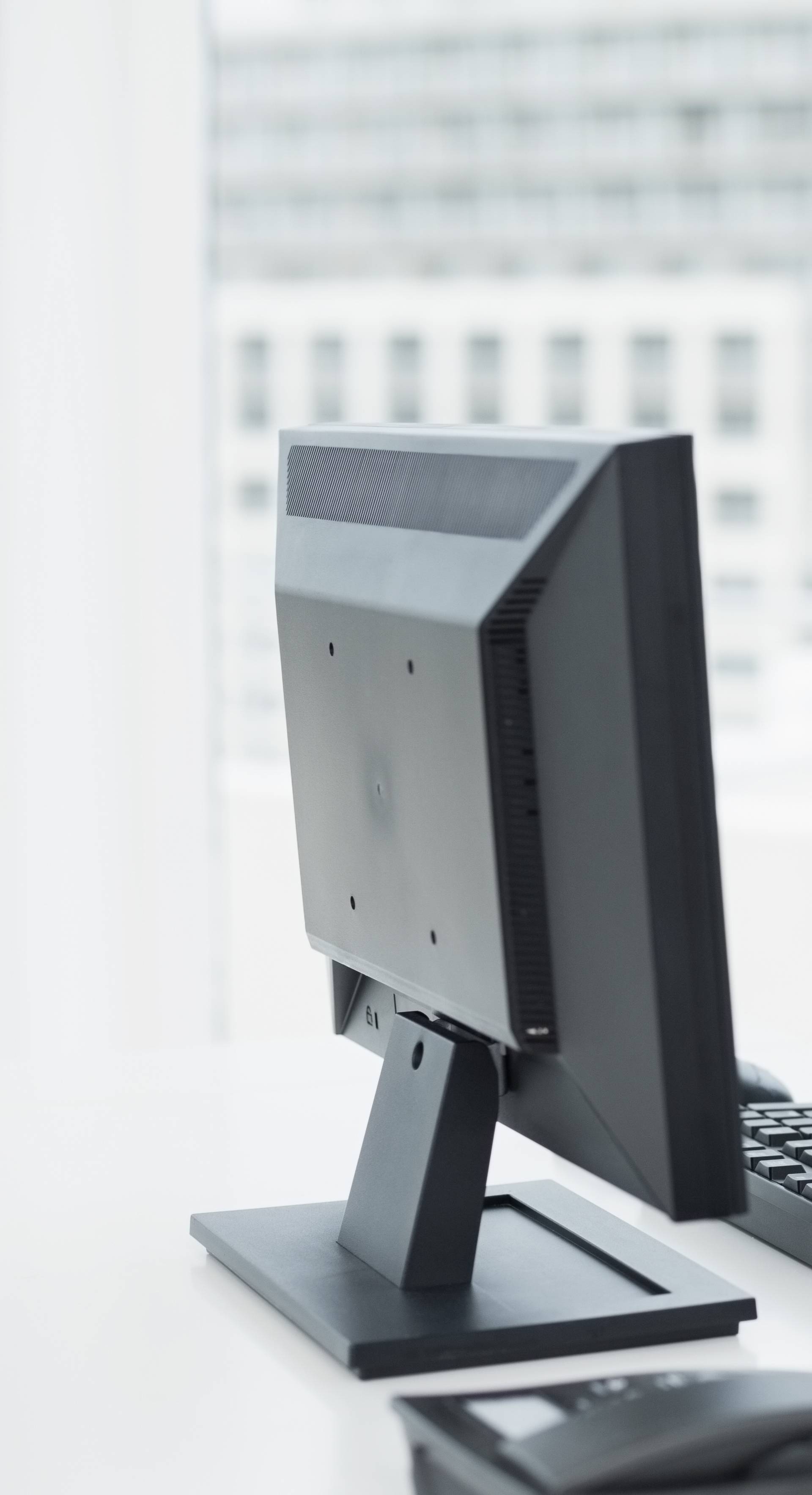 Businesswoman with neck pain sitting at office