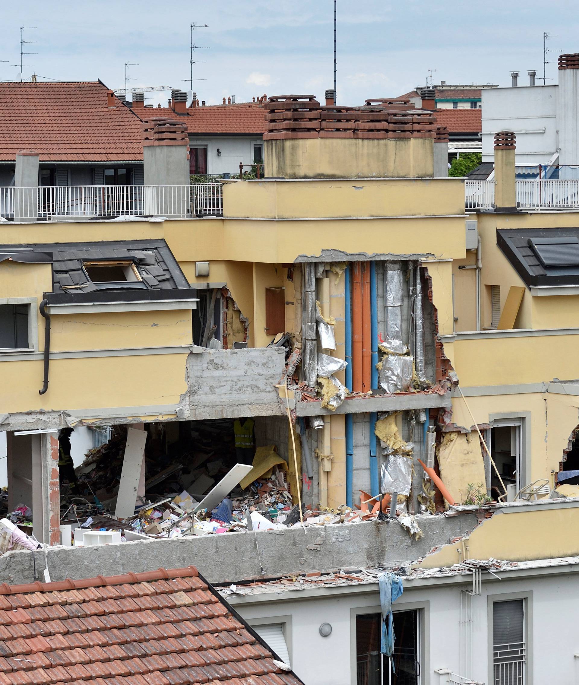 A residential building is seen partially collapsed on Sunday following an explosion in Milan