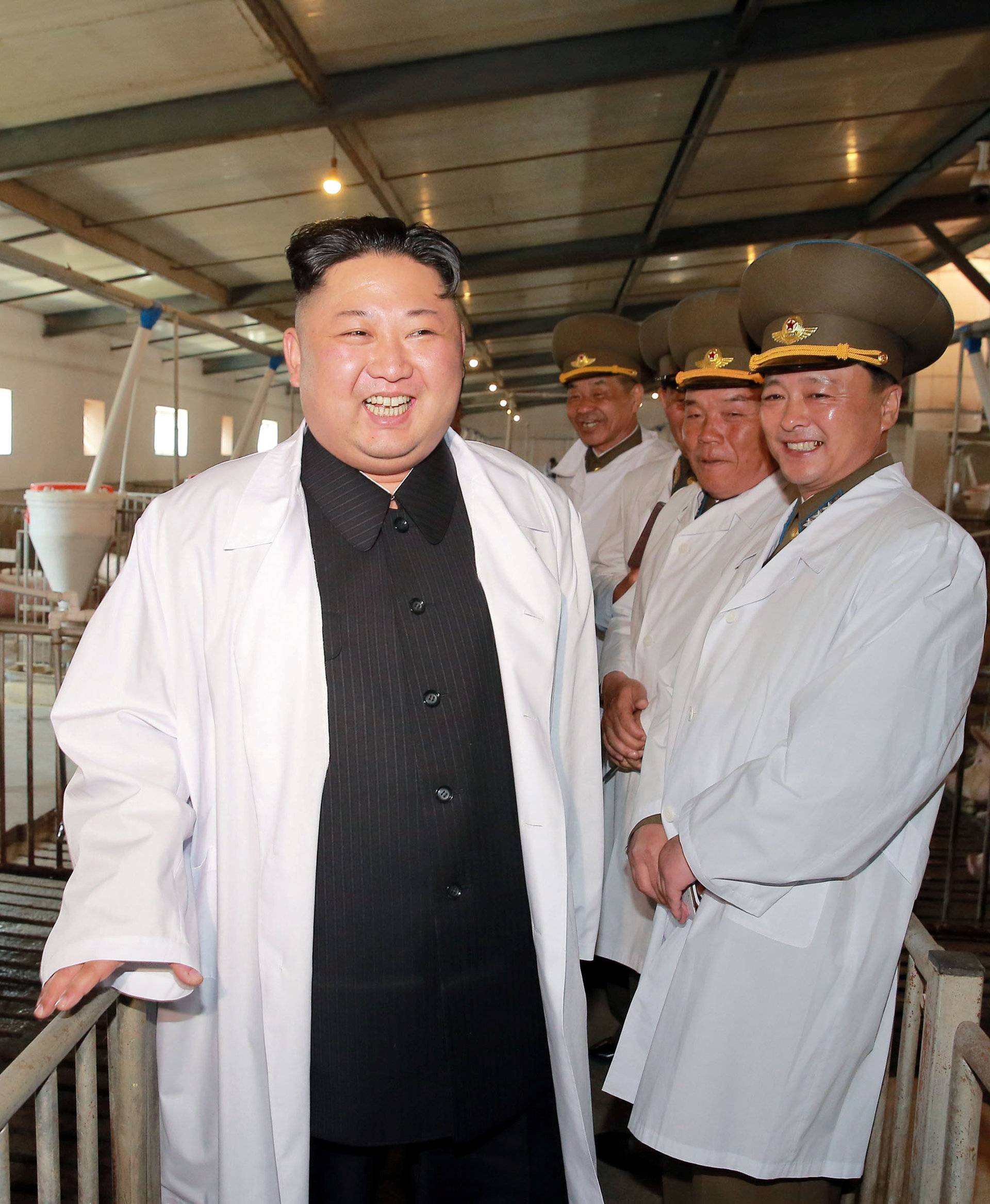 KCNA photo shows a visit by North Korean Leader Kim Jong Un to the Thaechon Pig Farm of the Air and Anti-Air Force of the Korean People's Army