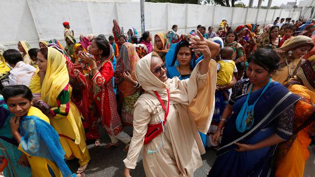 A Hindu devotee dances during the Rath Yatra, or chariot procession in Karachi