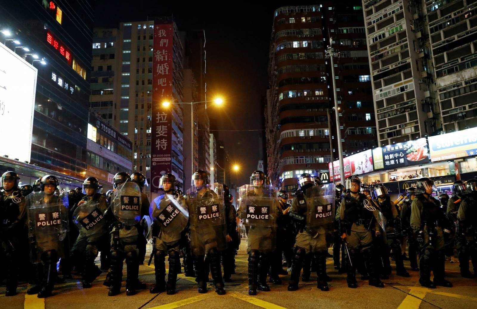 Riot police officers are seen near Mong Kok police station in Hong Kong