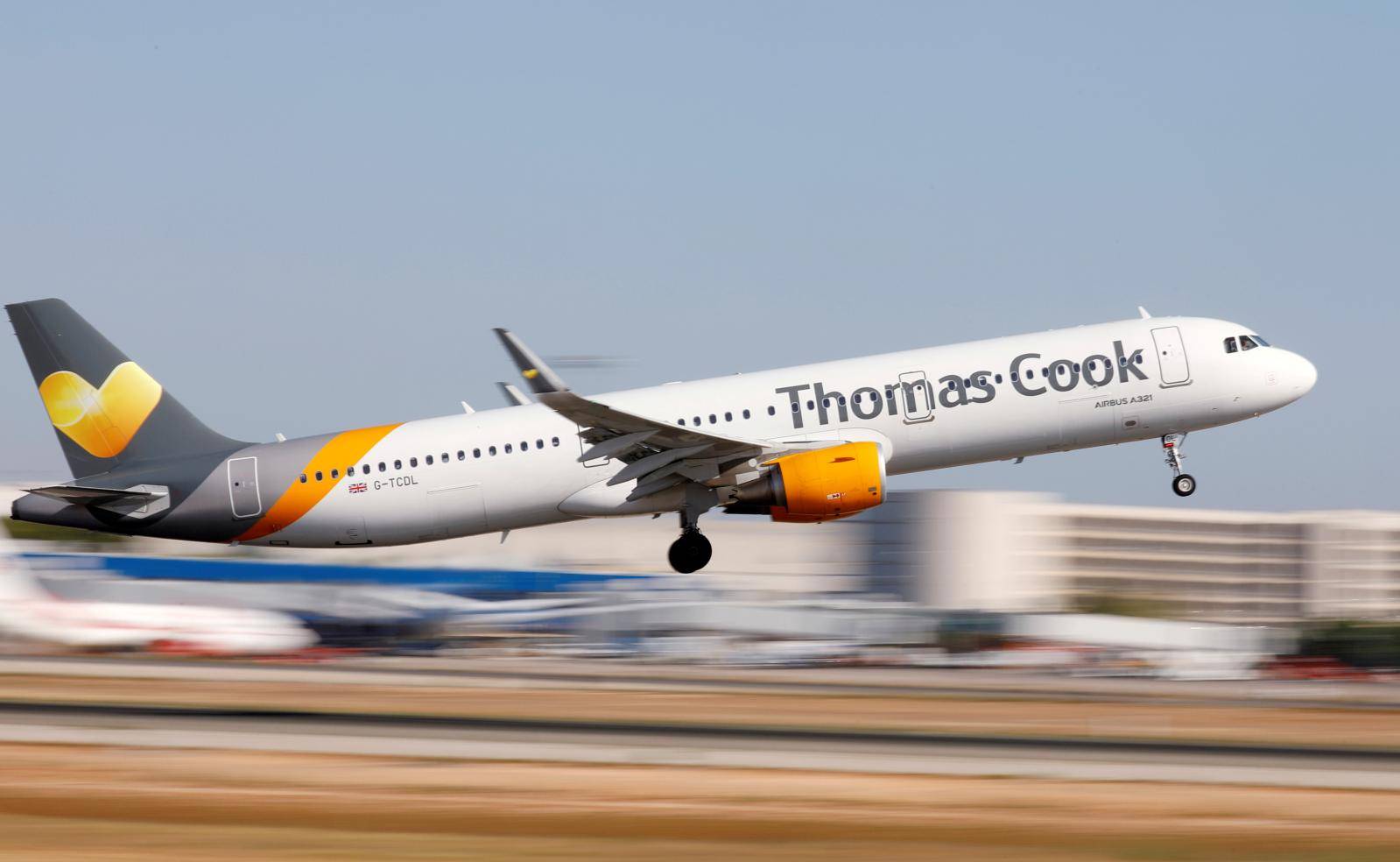 FILE PHOTO: A Thomas Cook Airbus A321 airplane takes off at the airport in Palma de Mallorca