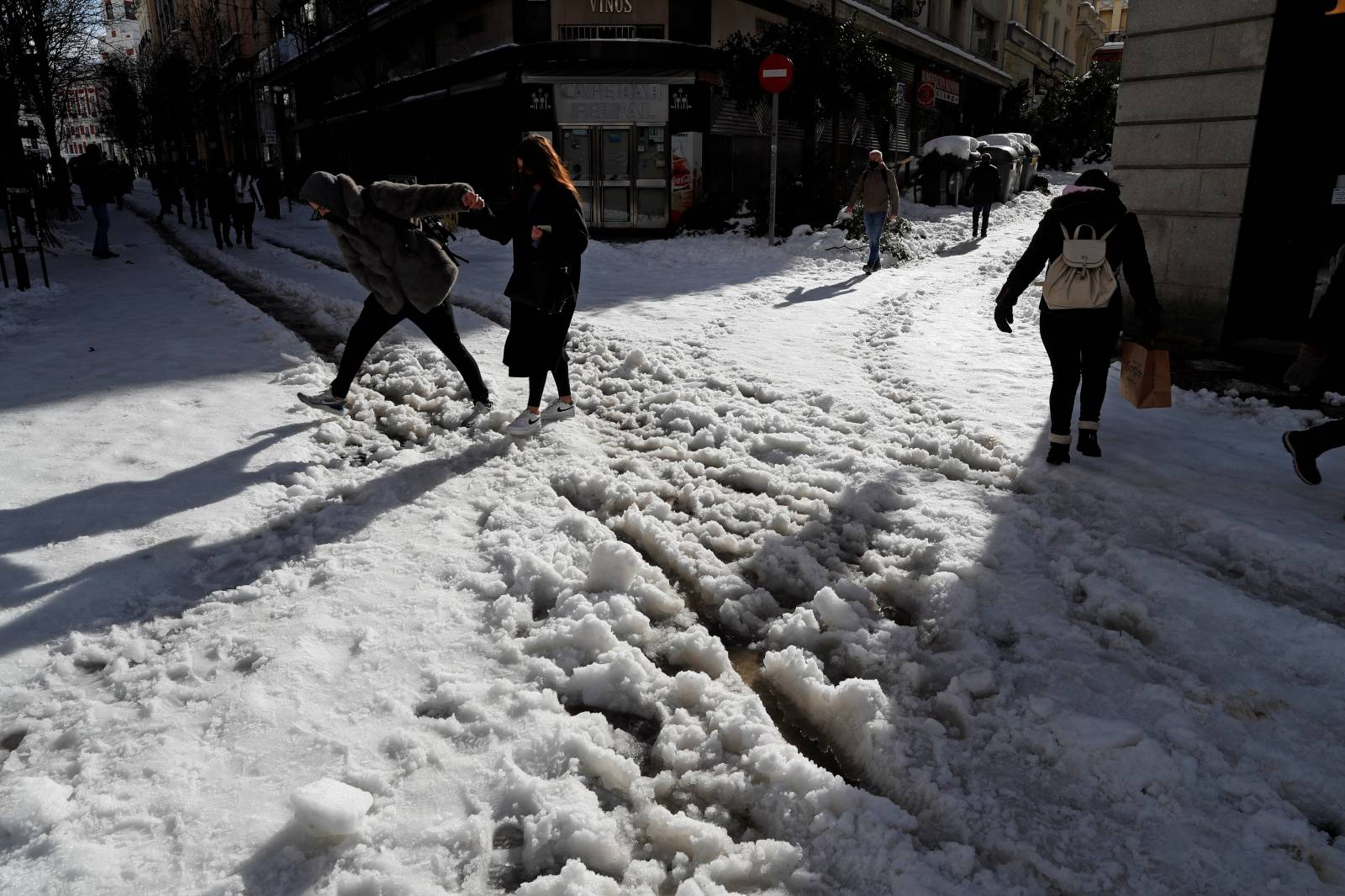 People wade through the snow in Madrid