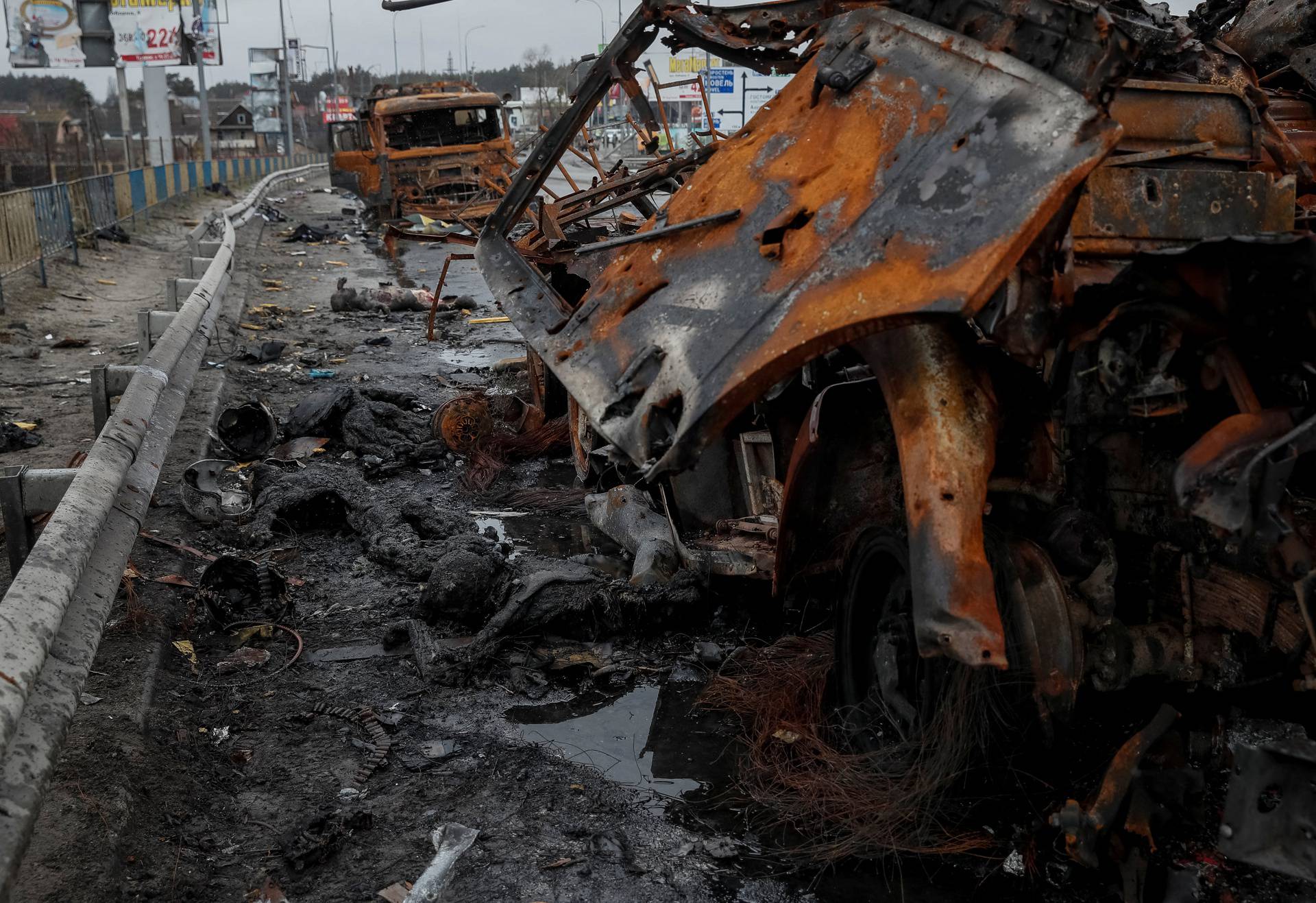 Bodies of Russian soldiers lie near burned military vehicles, amid Russian invasion on Ukraine, in Bucha