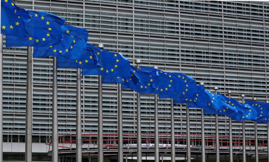 European Union flags flutter outside the European Commission headquarters in Brussels