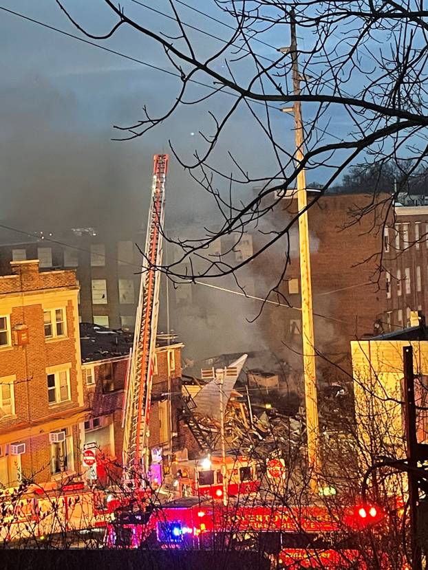 A general view shows smoke coming out from a chocolate factory after fire broke out, in West Reading