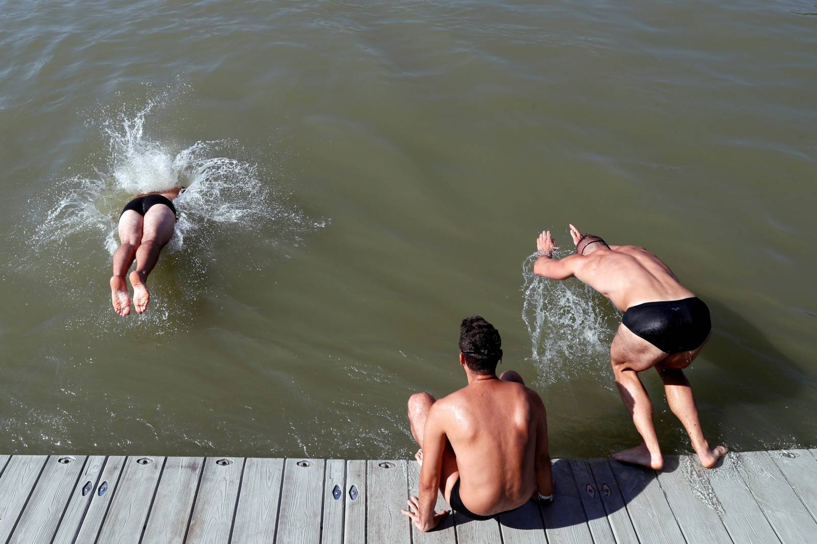 Participants swim across the Danube River during the Budapest Urban Games in Budapest