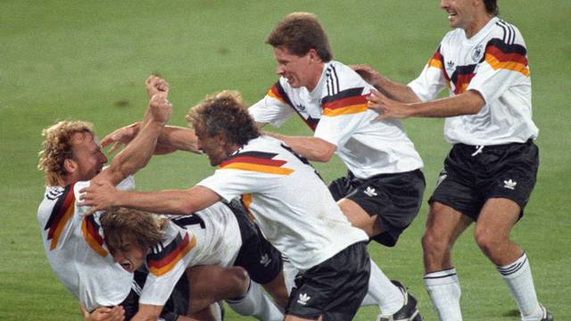 FILE PHOTO: West Germany's Brehme is mobbed by teammates after he scored the only goal of the World Cup final against Argentina on a penalty kick