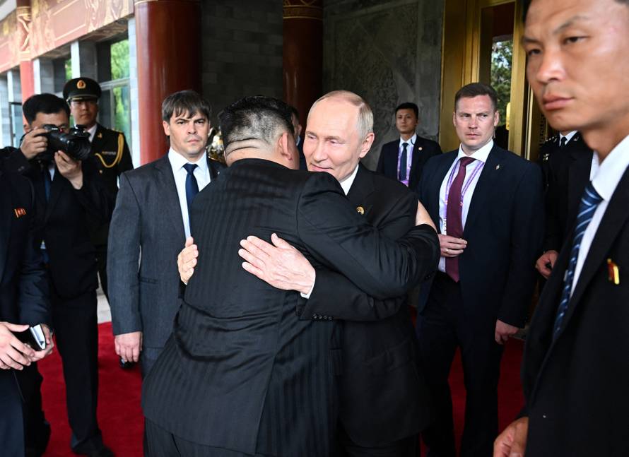 Russian President Vladimir Putin meets with North Korean leader Kim Jong Un in Beijing