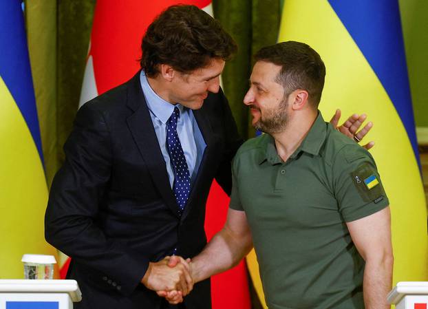 Canadian Prime Minister Trudeau and Ukraine's President Zelenskiy shake hands during press conference in Kyiv
