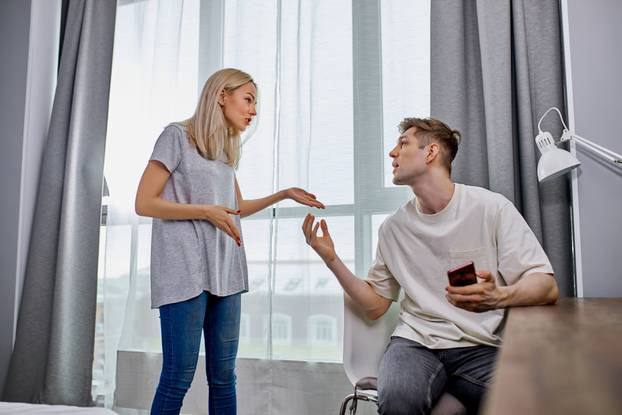 young woman unhappy that man is constantly messing around