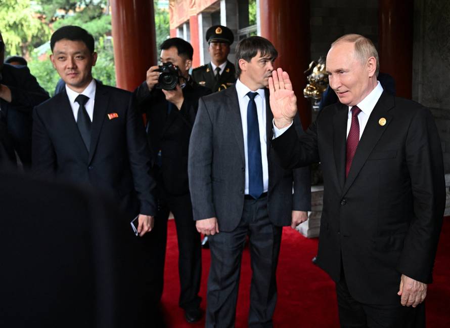 Russian President Vladimir Putin meets with North Korean leader Kim Jong Un in Beijing