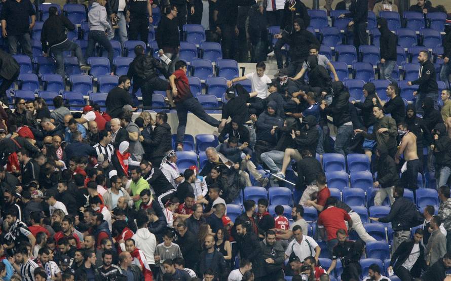 Besiktas and Lyon fans clash in the stands