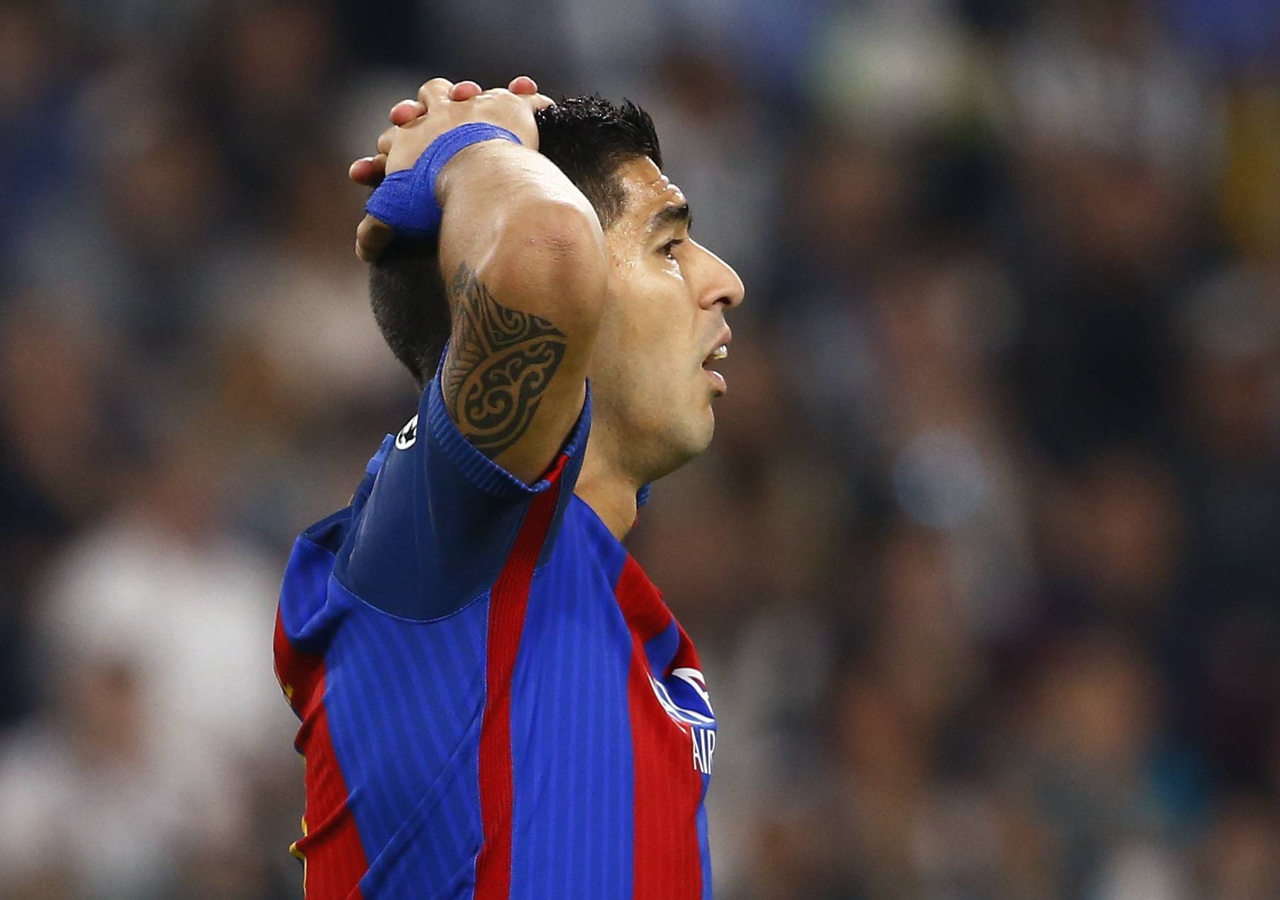 Barcelona's Luis Suarez looks dejected after Juventus' Paulo Dybala scored their second goal