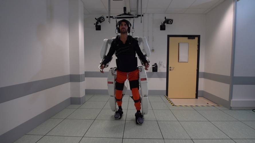 A patient with tetraplegia walks using an exoskeleton in Grenoble